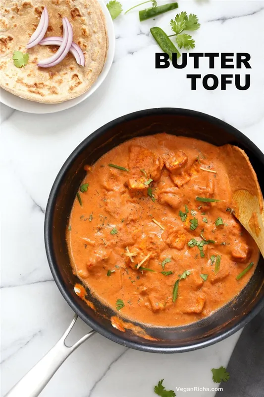 Indian Butter Tofu in Black skillet over Marble